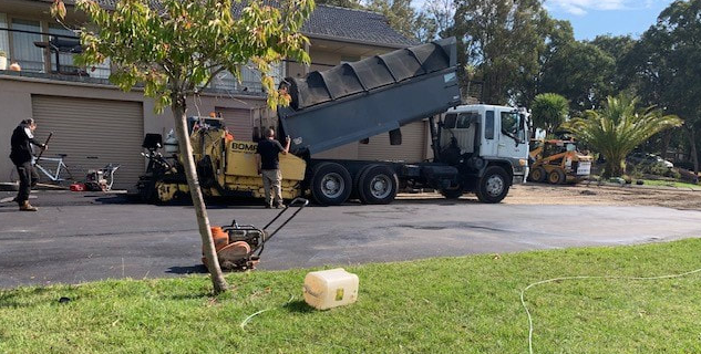 This is a photo of an asphalt driveway which is in the process of being installed by Morayfield Surfacing Solutions