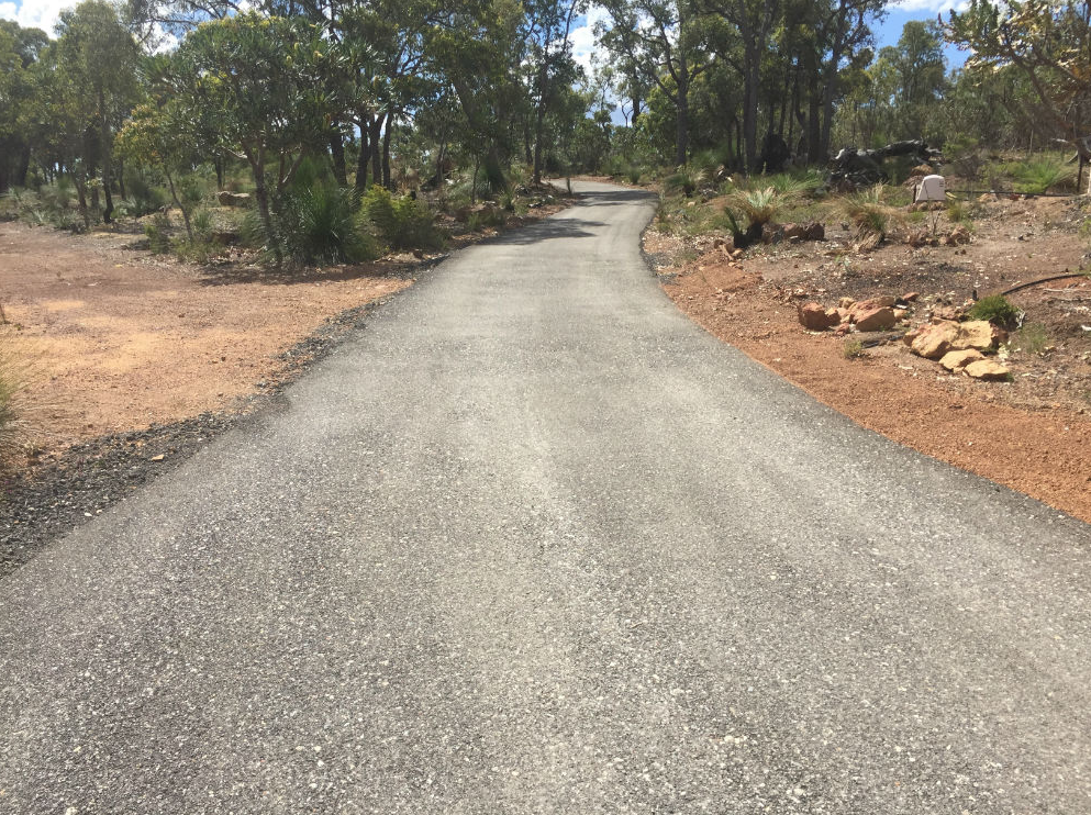 This is a photo of a hot spray & seal bitumen driveway which is in the process of being installed by Morayfield Surfacing Solutions